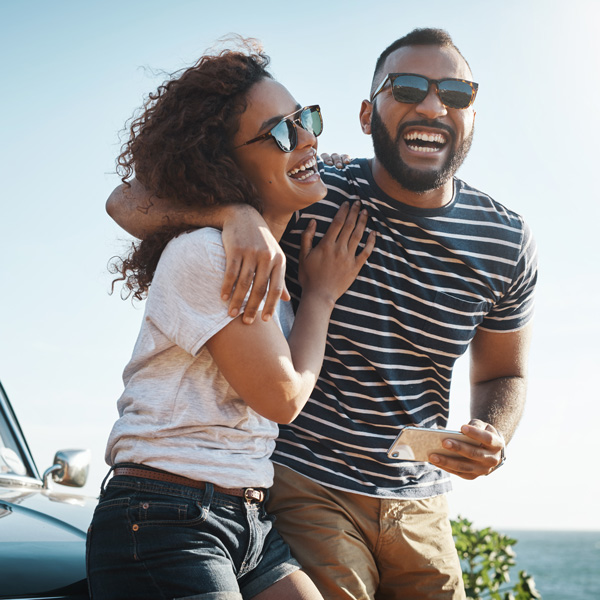 adult couple laughing outdoors