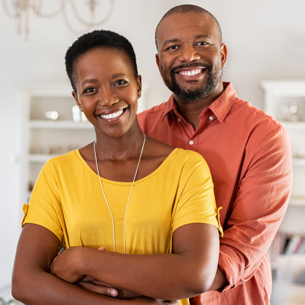 adult couple hugging and smiling